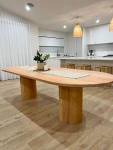 American Ash Oak dining table with pedestal legs. Contemporary 8-seater dining table in natural matte finish