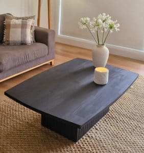 Contemporary black timber coffee table with clean lines and natural finish